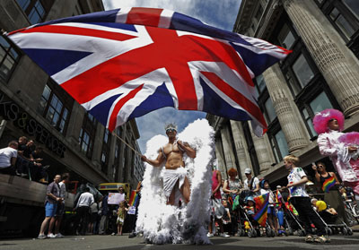 A participant waves a Union flag during the annual Pride London parade